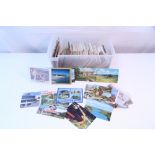 Approximately nine hundred various loose postcards & family photographs including British &