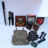 Two Commando knives; a rifle bayonet; a respirator, etc.