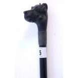 An early 20th century gent's ebony walking cane with carved treen dog's head handle & with white-