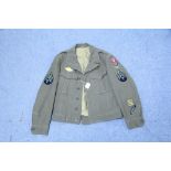 A WWII U. S. Ike jacket (dated 1944).