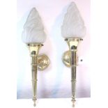 A pair of 1960's brass wall-mounted lights, each with frosted glass "flame" shade, 23" high.