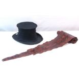A 7ft 8" long snake skin; together with a black opera hat (w.a.f.).