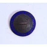 A bronzed & blue enamelled German Zeppelin badge inscribed “Friedrichshafen, Tokio, Los Angeles,