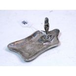 A George V cast cigar ashtray of rectangular shape with waisted sides & thumb-piece handle to one