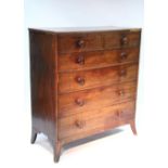 An early 19th century mahogany tall chest fitted two short & four long graduated drawers with turned