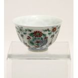 A Chinese Doucai ‘flower medallion’ teabowl painted in underglaze blue & enamelled in green, yellow,