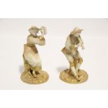 A pair of Royal Worcester porcelain seated figures of the boy piper Strephon, & his female companion