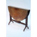 A Victorian mahogany oval Sutherland table on slender turned supports; 36" x 40".