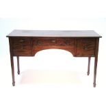 A 19th century mahogany sideboard fitted three drawers with brass ring handles, on square tapered