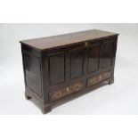An 18th century oak mule chest with lift lid, four fielded panels to the front, & fitted two shallow