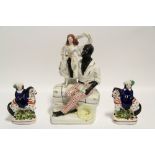 A Victorian Staffordshire pottery flat-back group of Uncle Tom & Eva (?), 11¼" high; & a ditto small