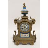 A 19th century French mantel clock in gilt speltre case inset Sevres-style porcelain panels, with