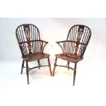 A pair of 19th century ash & elm Windsor elbow chairs with pierced splats to the hooped spindle