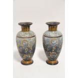 A pair of Doulton Lambeth stoneware ovoid vases with blue & gilt floral decoration, faience leaf