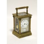 A Margaine large carriage clock with 2" diam. enamel dial & subsidiary alarm dial set in a