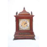 A late 19th century striking mantel clock, the 6" square brass & silvered dial inscribed: “J.