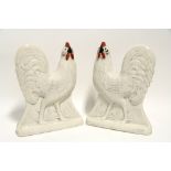 A PAIR OF VICTORIAN STAFFORDSHIRE POTTERY FLAT-BACK MODELS OF COCKERELS, with red wattles & combs,