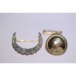 A diamond crescent brooch set fifteen graduated stones, the largest approx. 0.2 carat, to an 18ct