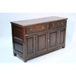 A well-made early 18th century style oak small sideboard fitted two frieze drawers with brass ring