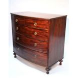 An early 19th century mahogany bow-front chest fitted two short & three long graduated drawers