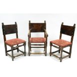 A set of twelve 17th century-style oak dining chairs, including a pair of elbow chairs, with leather