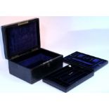 A black morocco leather jewellery box stamped “Asprey, Bond St”, 13” wide.