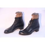 A pair of late Victorian black leather boots, with trees.