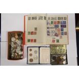 A quantity of British & foreign coins; & a small stamp album & contents.