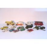 Fifteen Dinky die-caste scale models including a “Fire Engine” (No. 955), a “Brinks Armoured Car” (