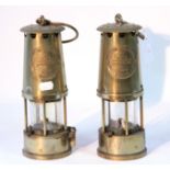 A pair of Eccles “Type 6” brass miner’s lamps.