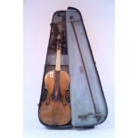 A late 19th century violin & bow, the violin bears label “Wolff Bros, 1888”, w.a.f., cased.