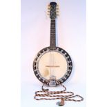 A Broadcaster banjo, 24” long, with case.