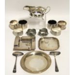 A silver sauce boat on three pad feet, 5” long, Birmingham 1964; three silver ashtrays; a silver