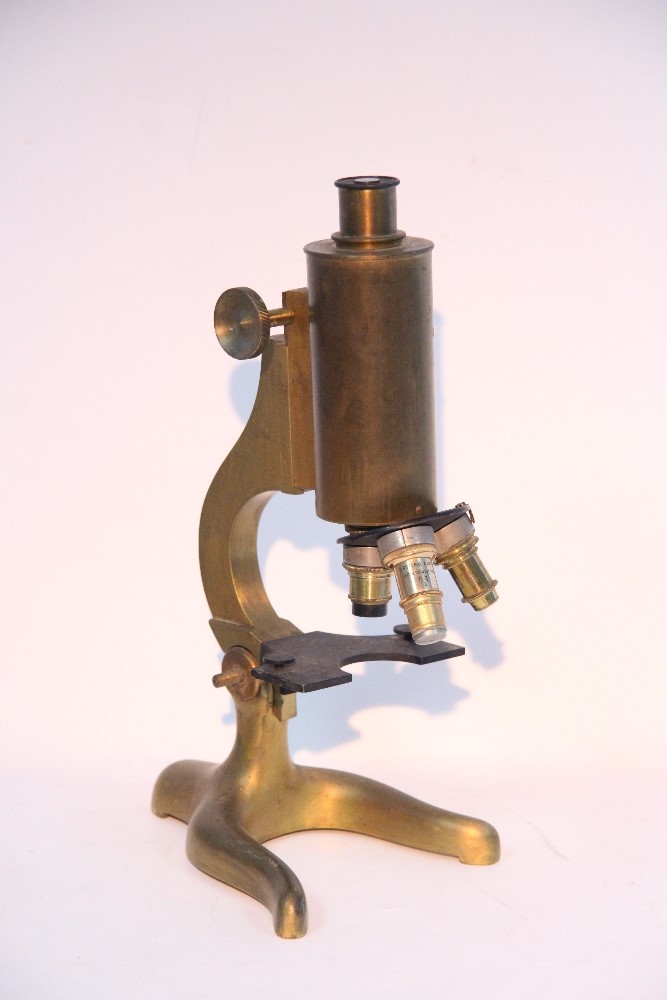 A brass monocular microscope, 12¾” high, un-cased.
