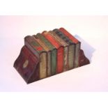 A Huntley & Palmers novelty biscuit tin in the form of a row of seven books & a pair of bookends,