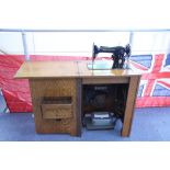 A 1930’s Singer electric treadle sewing machine (No. 201k), in oak case, complete with numerous