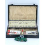 A Dinky die-cast scale model car “Bristol 450” (No. 163), unboxed; and a cribbage board set, cased.