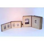 Two late 19th/early 20th century leather-bound family photograph albums containing a total of