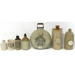 An Old Fulham pottery “Adaptable Hot Water Bottle & Bed Warmer”, 10" diam.; together with two