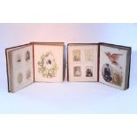 Two Victorian leather-bound family photograph albums containing a total of one hundred and eighty
