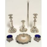 A pair of 19th century telescopic candlesticks with foliate borders, round columns, & on shaped