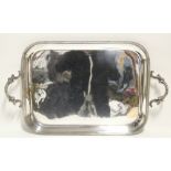 A rectangular two-handled tea tray with rounded corners & raised beaded rim; 24½” x 14­½”.