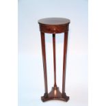 A good quality reproduction Adam style mahogany jardinière stand with circular top on three