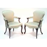 A PAIR OF 18th century MAHOGANY ARMCHAIRS, the rounded backs, padded open arms, & wide seats