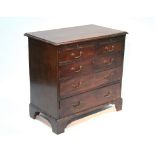 A late 18th century mahogany small chest fitted brushing slide above four long graduated drawers