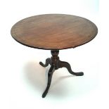 A late 18th century mahogany tripod table, the one-piece circular tilt-top inlaid in boxwood with