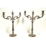 A PAIR OF 19th century TABLE CANDELABRA each with two foliate scroll arms & central sconce, on round