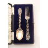 A Victorian christening fork & spoon, each with cast & pierced grape-vine stem; London 1863, by