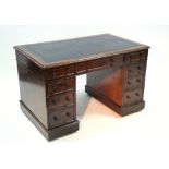 A Victorian mahogany pedestal desk inset tooled leather top, fitted nine drawers with turned knob