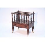 A mid-Victorian rosewood Canterbury of three divisions with turned spindles & barley-twist corner
